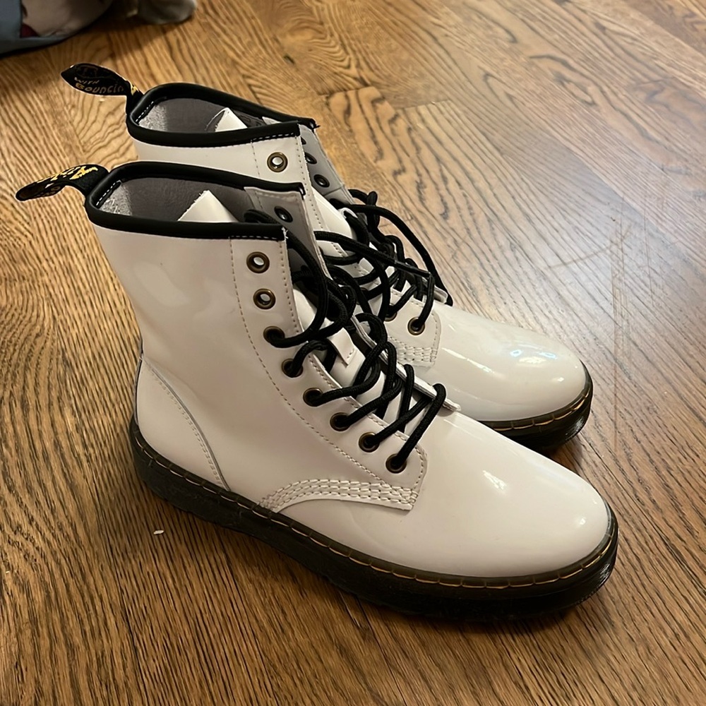 Woman’s white doc martins